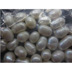 40 loose white freshwater pearls. Drilled