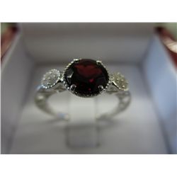 Red garnet dinner ring set with 8 diamonds