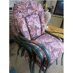 Four patio chairs with upholstered seats and backs