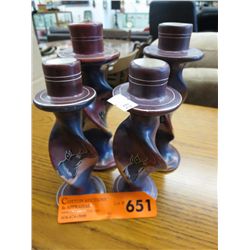 Four carved soapstone candlestick