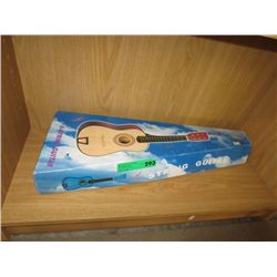 Six string miniature guitar in blue