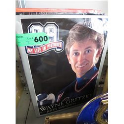 Three hard cover books on hockey