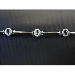 Blue topaz sterling silver ladies tennis bracelet