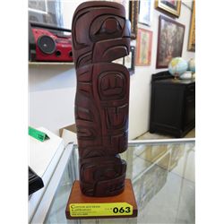 Carved native totem statue "Eagle Bear"