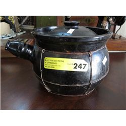 Old ceramic fireplace cooking pot