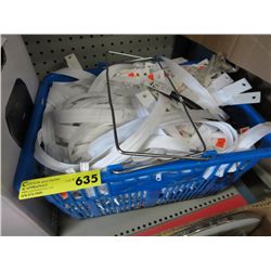 Basket full of zippers, mostly white