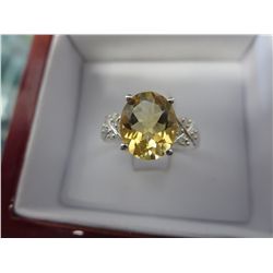 Oval cut citrine dinner ring with 8 diamonds