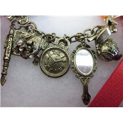 Bronze charm bracelet with 10 charms