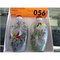 Two glass snuff bottles with stoppers