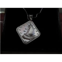 Silver chain with sail boat pendant