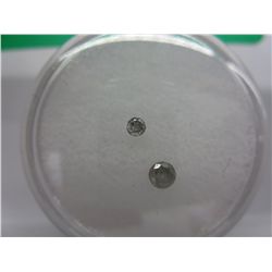 Two loose round cut diamonds