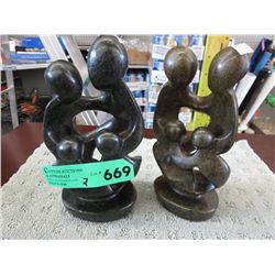 2 carved soapstone statues 9" tall, 4" wide