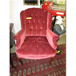 Velvet upholstered wing back chair