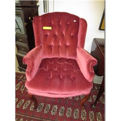 Velvet upholstered wing back chair