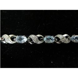 Blue Topaz & Diamond tennis bracelet