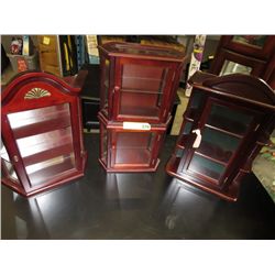 Four wall hanging display cabinets