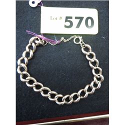 Faux gold bracelet with genuine gold safety chain