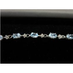 Sterling silver blue topaz tennis bracelet