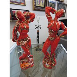 A pair of vintage glazed hand painted statuettes