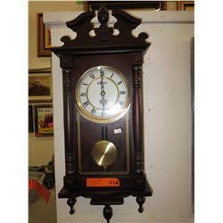 Wood pendulum wall clock by Volmond
