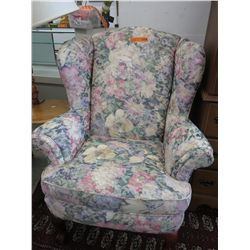 Upholstered wing back arm chair