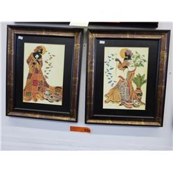 Two framed acrylic prints of tropical ladies