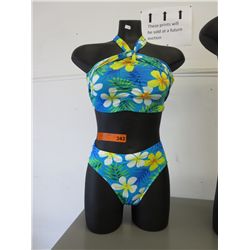 Female mannequin torso with bikini
