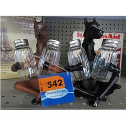 A pair of horse salt & pepper holders