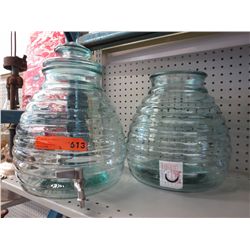 Two large glass beverage dispensers