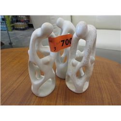 3 carved stone statues, 7" tall, 2" dia at base