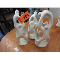 3 carved stone statues, 7" tall, 2" dia at base