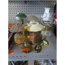 11 oil lamps ranging from 6" - 11" height