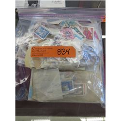Bag of stamps and a stamp book