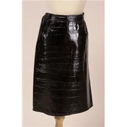 ungaro patent leather SKIRT The mid-length black patent leather skirt is printed in a faux crocod...