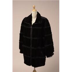 RABBIT AND PERSIAN LAMB JACKET The mid-length jacket with a leather trimmed zippered closure is i...