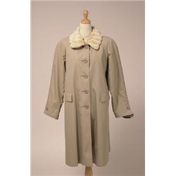 RAINCOAT WITH SHEARED RABBIT LINING AND TRIM The three-quarter length khaki coloured, water resis...