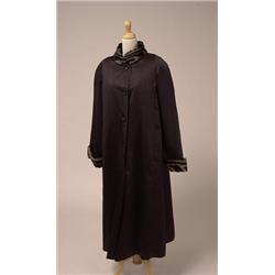 DYED RABBIT LINED SATIN COAT The full length, black, water resistant satin coat has a mandarin co...