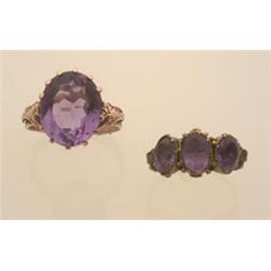 two vintage amethyst and gold rings Both rings are in 14K gold. One is in yellow gold with three...