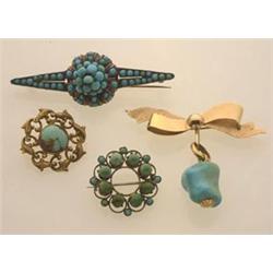 four antique turquoise and gold brooches First, a 14K yellow gold stylized bow knot with a Floren...