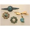 Image 1 : four antique turquoise and gold brooches First, a 14K yellow gold stylized bow knot with a Floren...