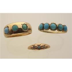 three Victorian turquoise rings First, an 18K yellow gold domed band is set with three 3.2 mm. ro...