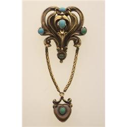 art nouveau turquoise and gold brooch In low karat gold, the openwork stamped lotus shaped top is...