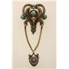 Image 1 : art nouveau turquoise and gold brooch In low karat gold, the openwork stamped lotus shaped top is...