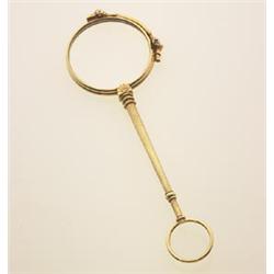 vintage gold lorgnette In 14K yellow gold, with folded round lens construction and pull-down spri...