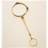 Image 1 : vintage gold lorgnette In 14K yellow gold, with folded round lens construction and pull-down spri...