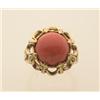 Image 1 : gold and coral ring In 14K yellow gold, a 12 mm. round coral cabochon is set in an eight claw pie...