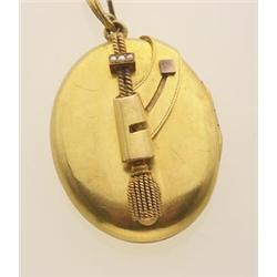 antique gold locket and chain The 14K yellow gold locket features a design of a stylized tassel h...