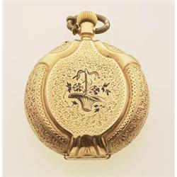 lady's pocket watch, gold case The 14K yellow gold case is elaborately engraved with enamelled ac...