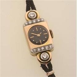 lady's retro wristwatch The rectangular case is in 14K rose gold and has two rows of five round b...