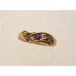 antique gold, ruby and diamond ring In 18K yellow gold, the band style ring is designed with chas...